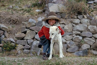 Wonderful girl with her dog Oro (Gold) at the Colca Canyon - Peru